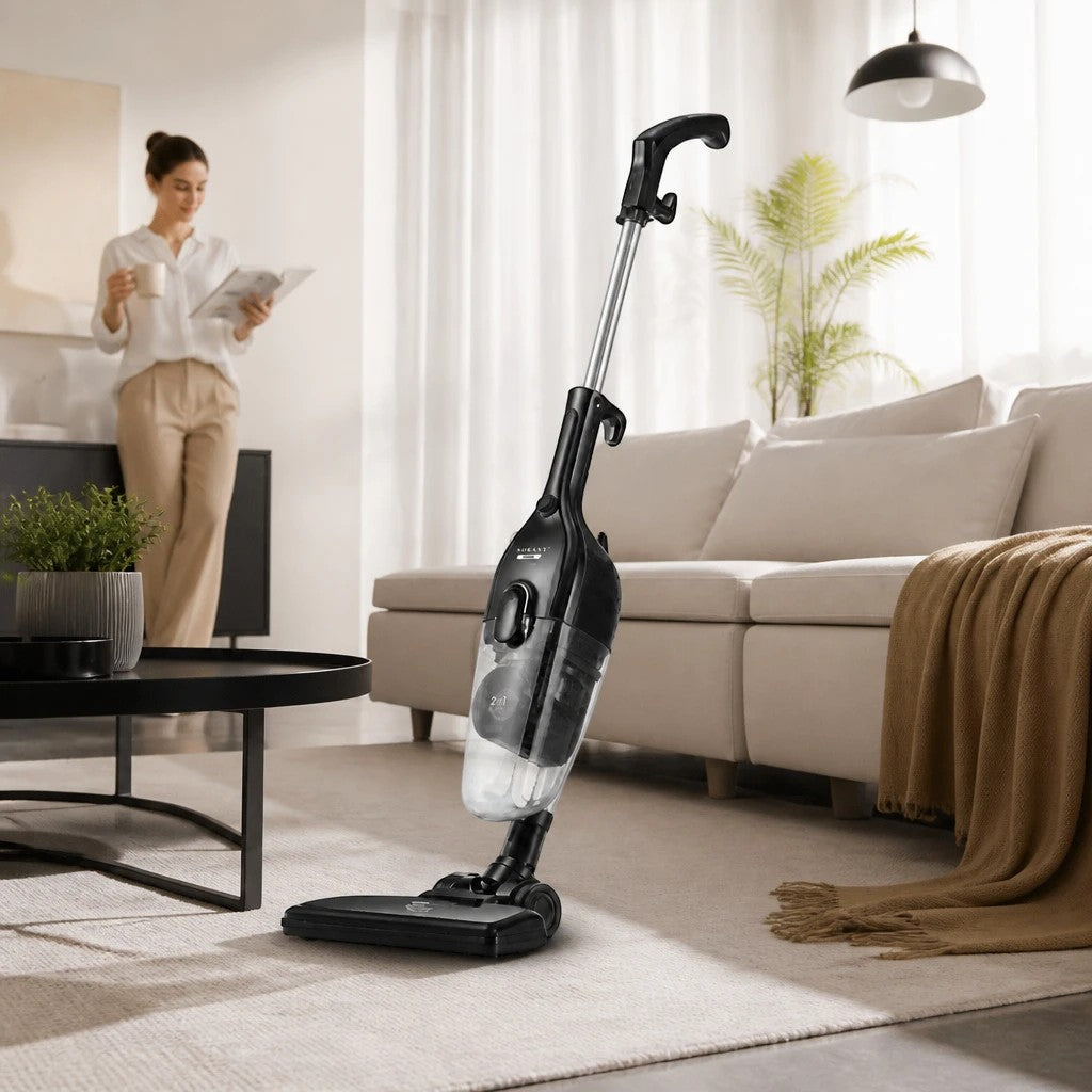 INOUTHOMECO SOKANY 2-in-1 corded stick vacuum cleaner in black, featuring a transparent dust cup in a modern living room